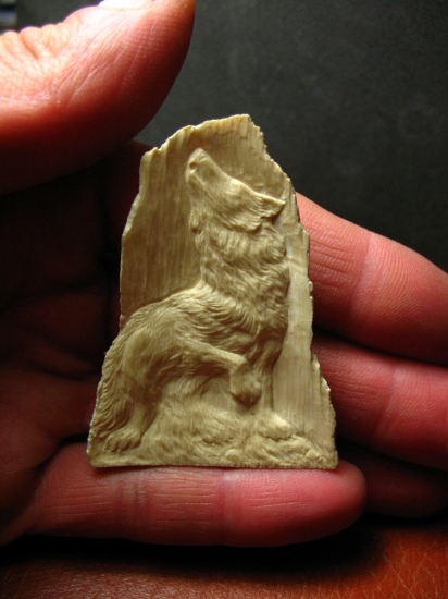 A howling wolf (mammoth tusk)