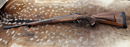 Zdobená kulovnice CZ 550 (řezby, eben, turecký ořech)